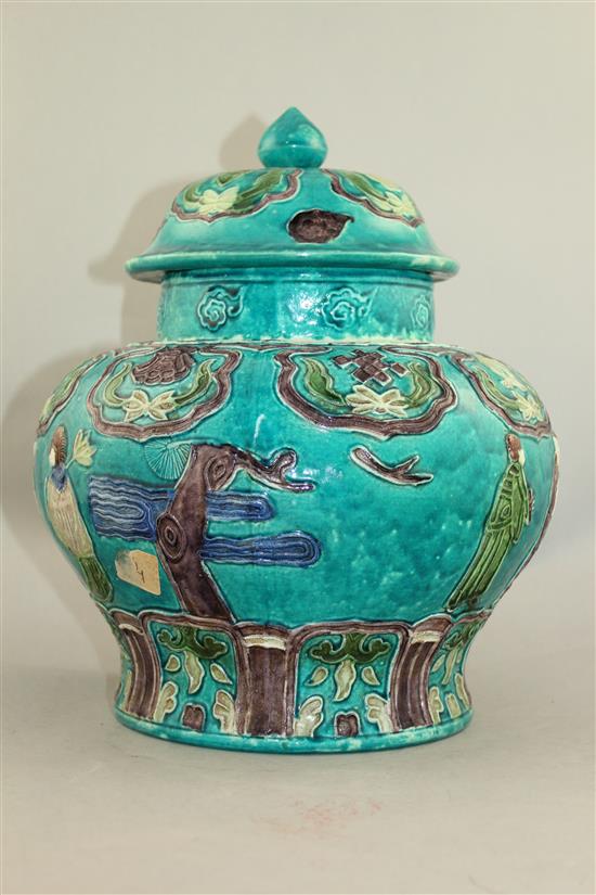 A Chinese Fahua decorated baluster jar and cover, 18th / 19th century, 32cm.